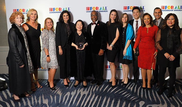 Cisco team standing together at an awards ceremony. 