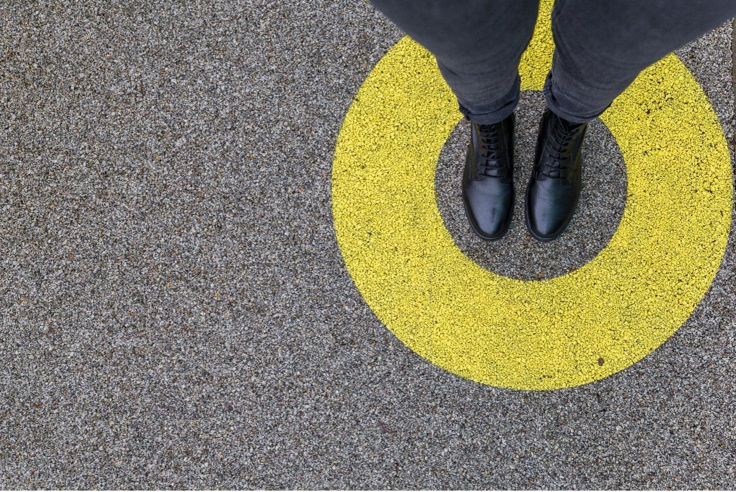 Standing in a yellow circle.