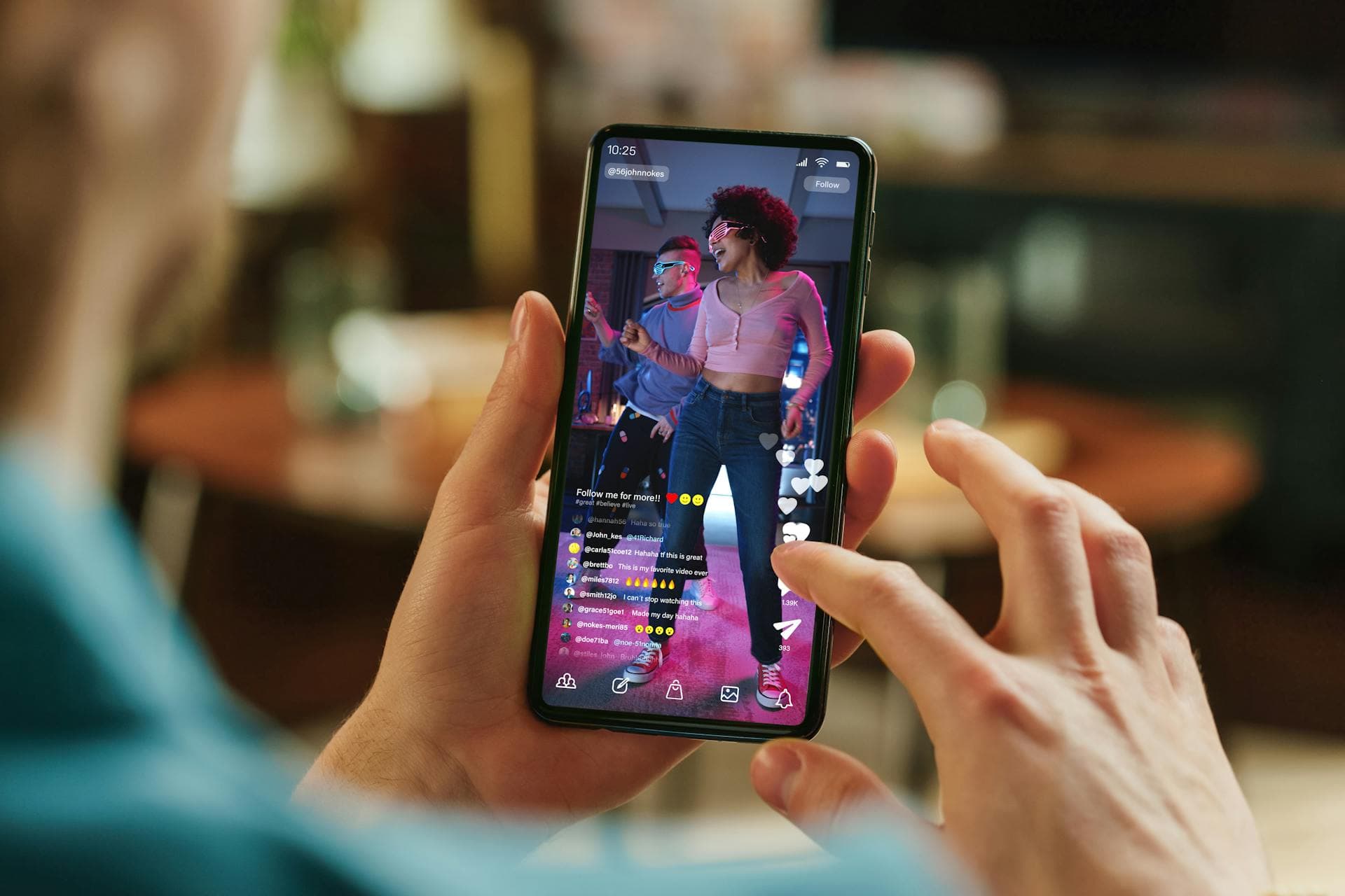 A person on his phone watching influencer video