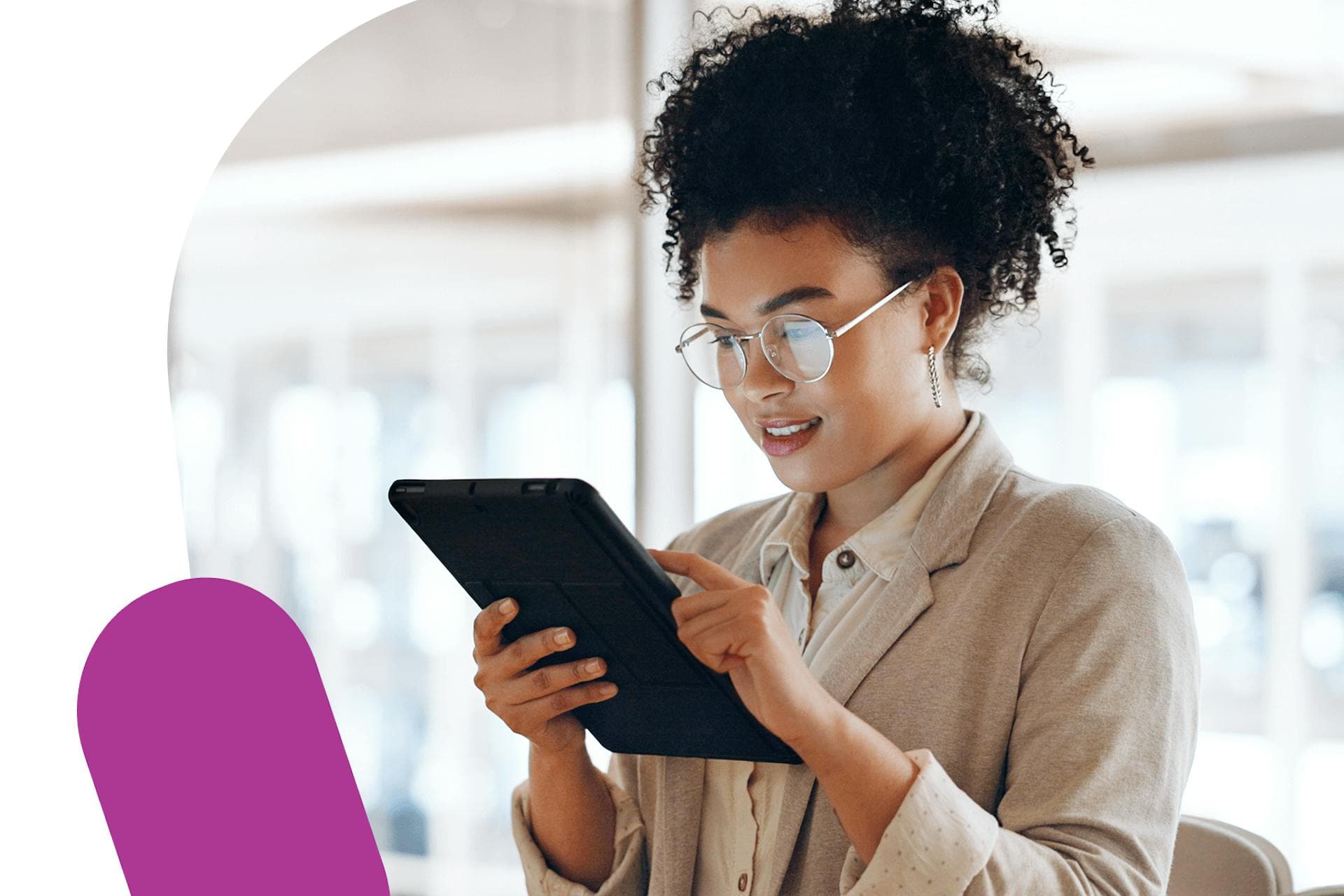 image of a female PR professional looking at a tablet for media relations campaign management