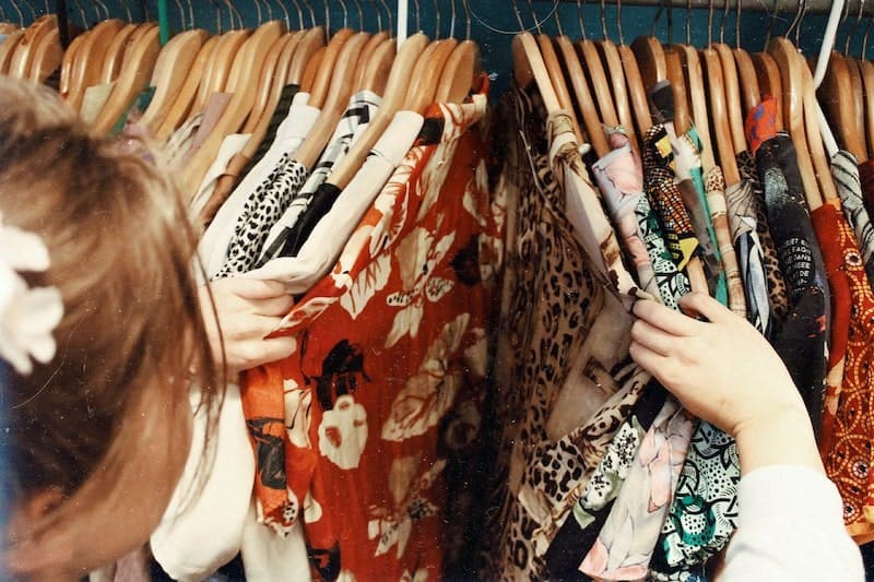 A girl is shopping for clothes. Various industries benefit from competitive intelligence such as telecommunications, pharmaceuticals, consumer goods and retail.