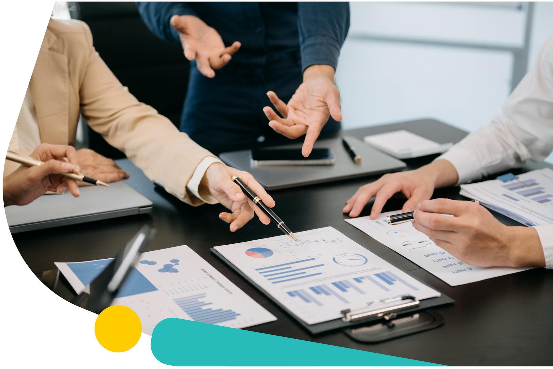 A group of three people in a meeting looking at several different graphs. Social Listening for Benchmarking Guide