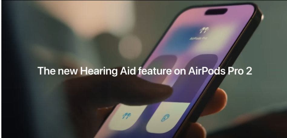 person holding a new iphone and adjusting sound volume