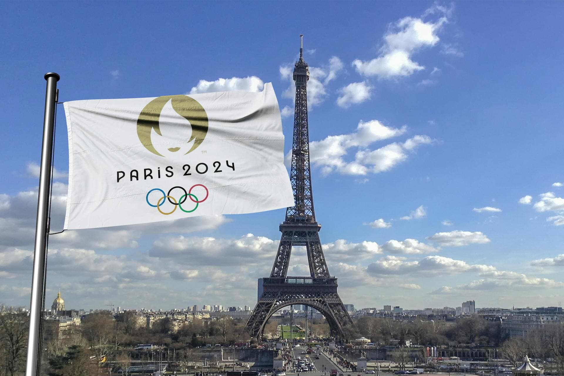 Une image de la Tour Eiffel et du drapeau des Jeux Olympiques.